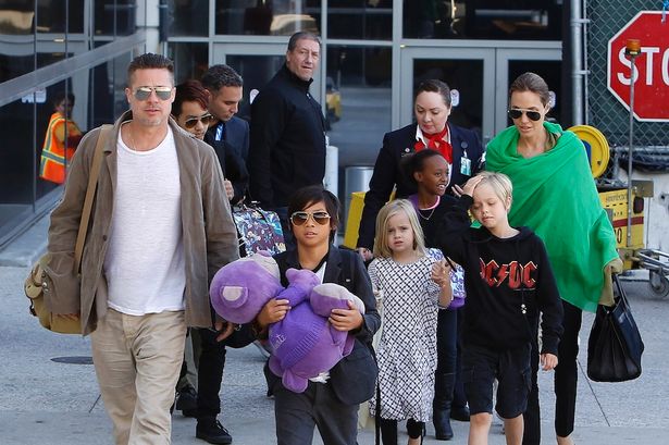 Brad-Pitt-Angelina-Jolie-and-family-arriving-at-the-Los-Angeles-International-Airport cf268